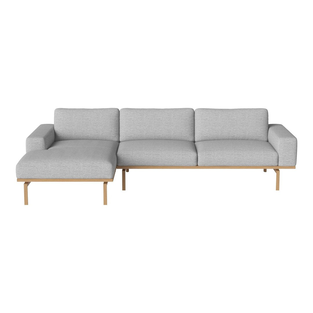 Gray fabric sectional sofa with clean lines and a minimalist design, featuring wooden legs for a contemporary look.