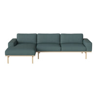 Modern teal sofa with a sleek design and minimalist wooden legs, featuring a smooth, textured fabric upholstery.