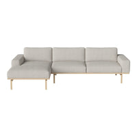 Light gray fabric sectional sofa with smooth, minimalist design and natural wood legs. Perfect for modern interiors.