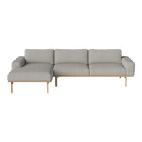 Light gray sectional sofa with a minimalist design and wooden legs, featuring a soft, smooth fabric texture.