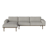 Gray sectional sofa with clean lines and a minimalist design, featuring solid color upholstery and a sleek metal frame.