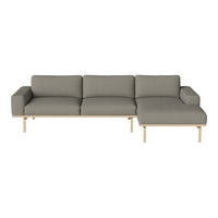 Grey fabric sectional sofa with minimalist wooden legs and clean lines, perfect for modern living spaces.
