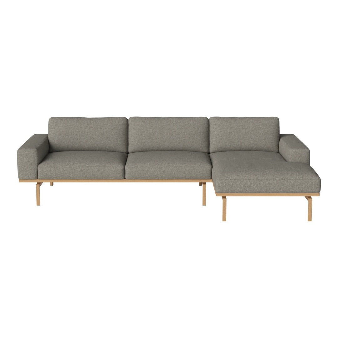 Gray sectional sofa with a minimalist design and natural wood legs. Ideal for modern living spaces.