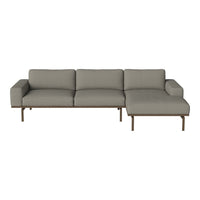 Gray sectional sofa with a sleek design, featuring clean lines and a modern minimalist aesthetic. Perfect for any living space.