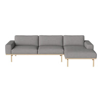 Modern gray sectional sofa with a minimalist design and natural wood legs, perfect for contemporary living spaces.