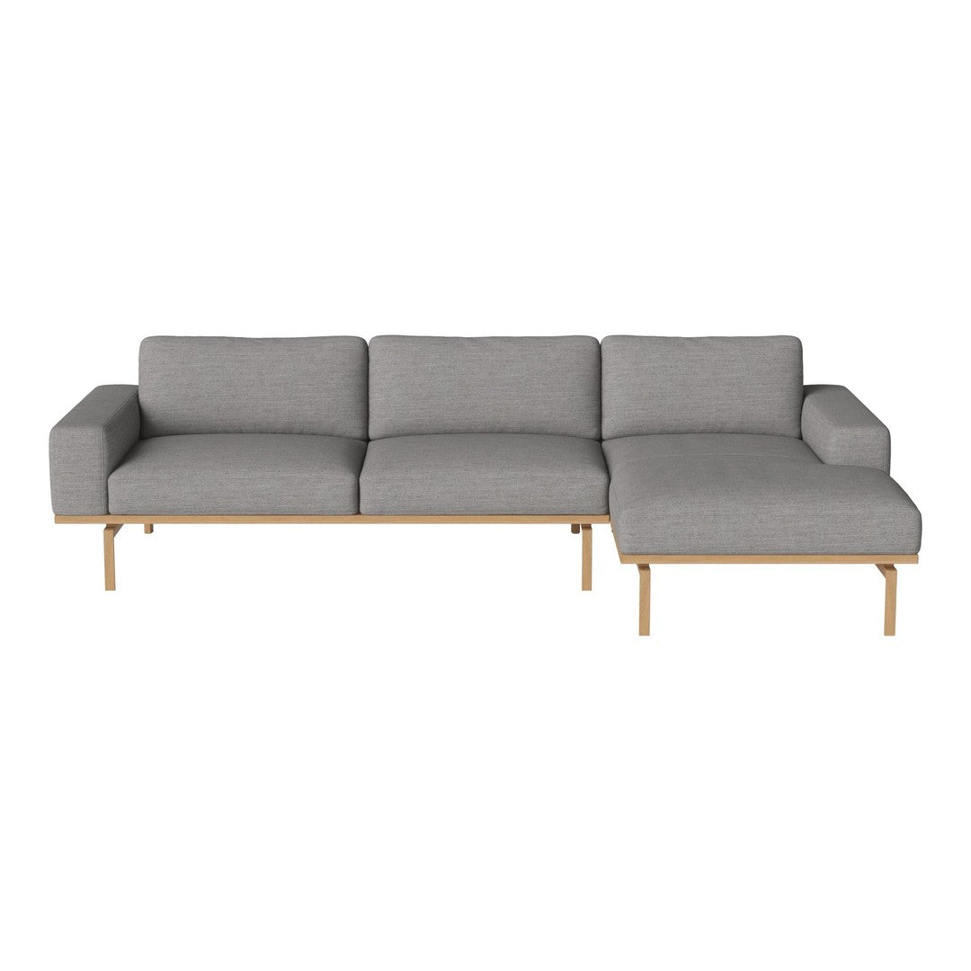 Gray fabric sectional sofa with a sleek design and natural wood legs. Modern and stylish for any living space.