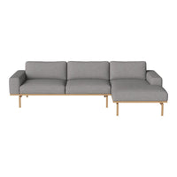 Gray fabric sectional sofa with a sleek design and natural wood legs. Modern and stylish for any living space.