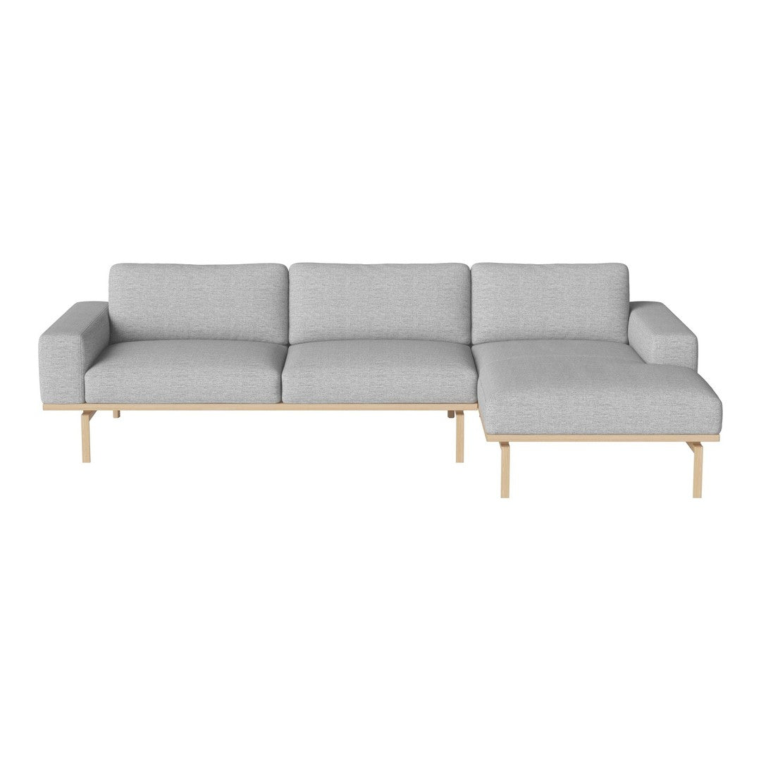 Gray upholstered sectional sofa with a clean design and light wood legs, perfect for modern living spaces.