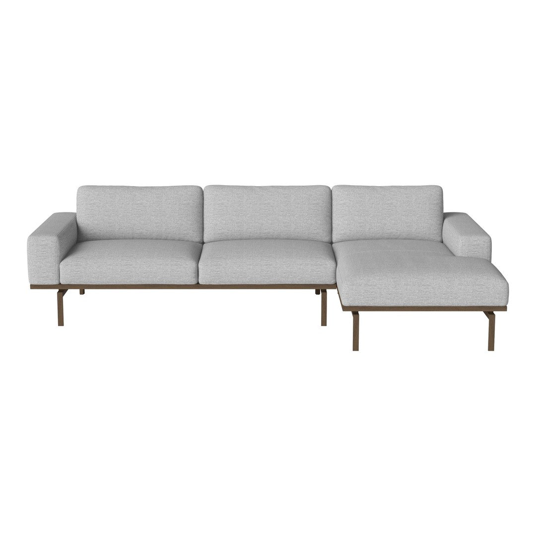 Light gray sectional sofa with clean lines and minimalist design, featuring a sleek bronze base.