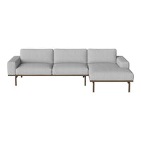 Light gray sectional sofa with clean lines and minimalist design, featuring a sleek bronze base.