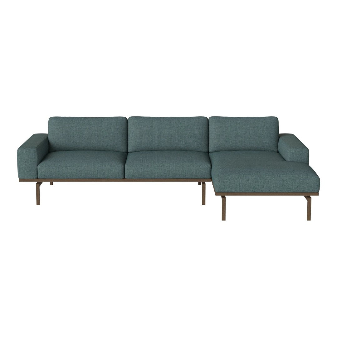 Teal upholstered sectional sofa with clean lines and a sleek, modern design. Ideal for stylish living spaces.
