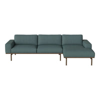 Teal upholstered sectional sofa with clean lines and a sleek, modern design. Ideal for stylish living spaces.