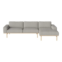 Light grey fabric sofa with clean lines and natural wood legs, perfect for modern, minimalist decor.