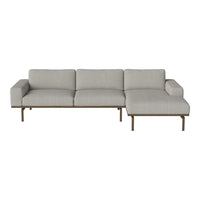Light gray sectional sofa with a modern design and subtle textured fabric pattern. Perfect for contemporary decor.