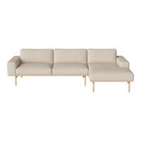 Beige sectional sofa with clean lines and minimalist design, featuring soft texture and light wood legs.