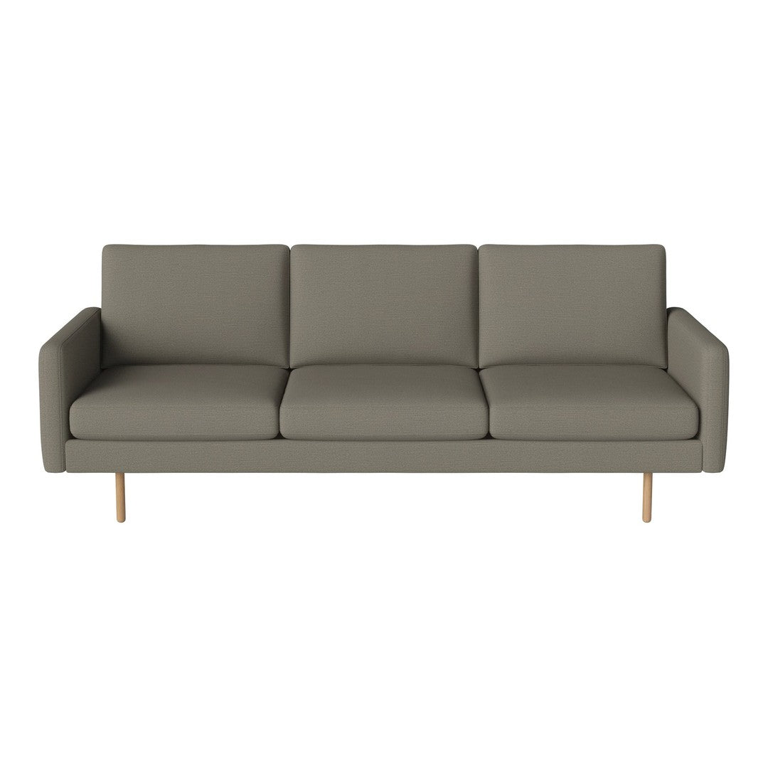 Modern gray sofa with clean lines and a minimalist design, featuring soft upholstery and wooden legs.