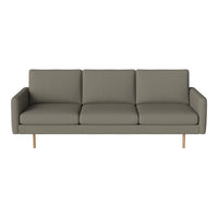 Modern gray sofa with clean lines and a minimalist design, featuring soft upholstery and wooden legs.