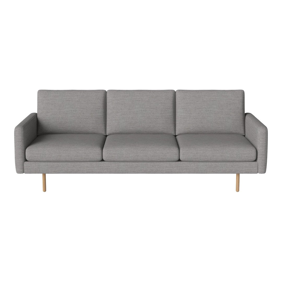 Modern gray sofa with clean lines and a minimalist design, featuring three plush cushions and light wood legs.