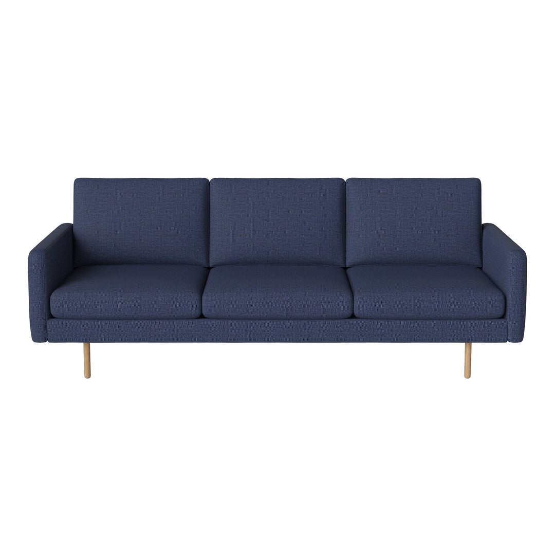 Navy blue upholstered sofa with clean lines and wooden legs, ideal for modern living spaces.