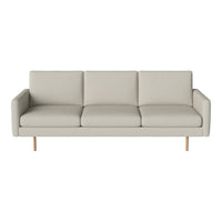 Stylish light gray sofa with clean lines and minimalist design, featuring smooth fabric cushions and wooden legs.