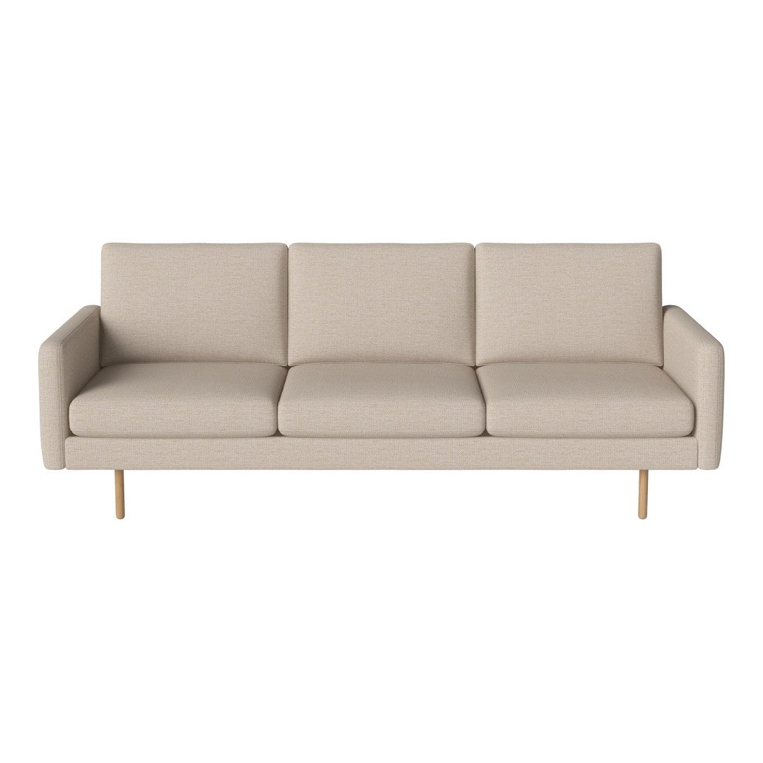 Beige fabric sofa with clean lines and smooth surface, featuring three cushions and golden legs for a modern touch.