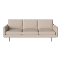 Beige fabric sofa with clean lines and smooth surface, featuring three cushions and golden legs for a modern touch.