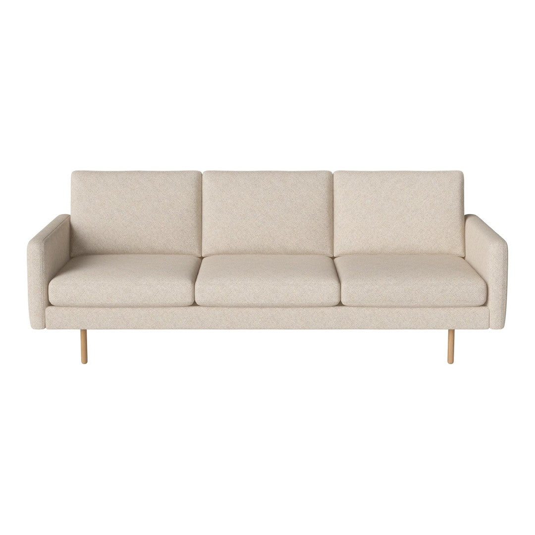Light beige sofa with subtle textured pattern and sleek wooden legs, perfect for modern living spaces.
