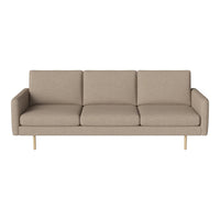 Beige three-seater sofa with a minimalist design and smooth texture, featuring subtle stitching details.