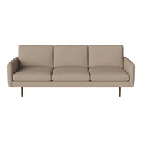 Beige upholstered sofa with a minimalist design and no visible patterns, featuring sleek metal legs.