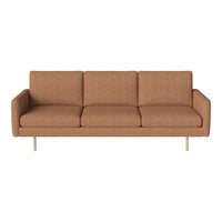 Stylish three-seater sofa in warm brown fabric with a smooth texture and sleek gold legs.