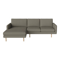 Grey sectional sofa with clean lines and minimalist design, featuring solid wood legs. Ideal for modern interiors.