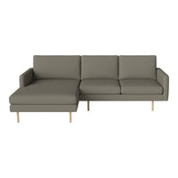 Modern grey sectional sofa with clean lines and minimalistic design, featuring solid wooden legs. Perfect for stylish interiors.