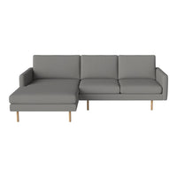 Gray sectional sofa with clean lines and minimalistic design, complemented by wooden legs. Perfect for modern decor.