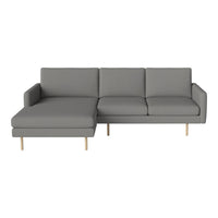 Gray upholstered sectional sofa with modern design and clean lines, featuring light wooden legs.