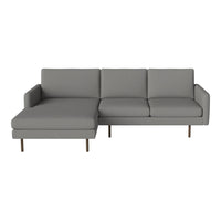 Gray sectional sofa with clean lines and smooth upholstery, featuring a modern minimalist design and sleek gold legs.