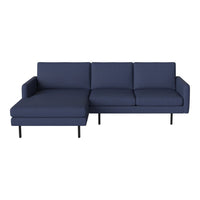 Navy blue sectional sofa with a modern design and clean lines, featuring solid color upholstery and sleek black legs.