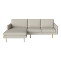 Light gray modern sectional sofa with clean lines and wooden legs, perfect for contemporary living spaces.