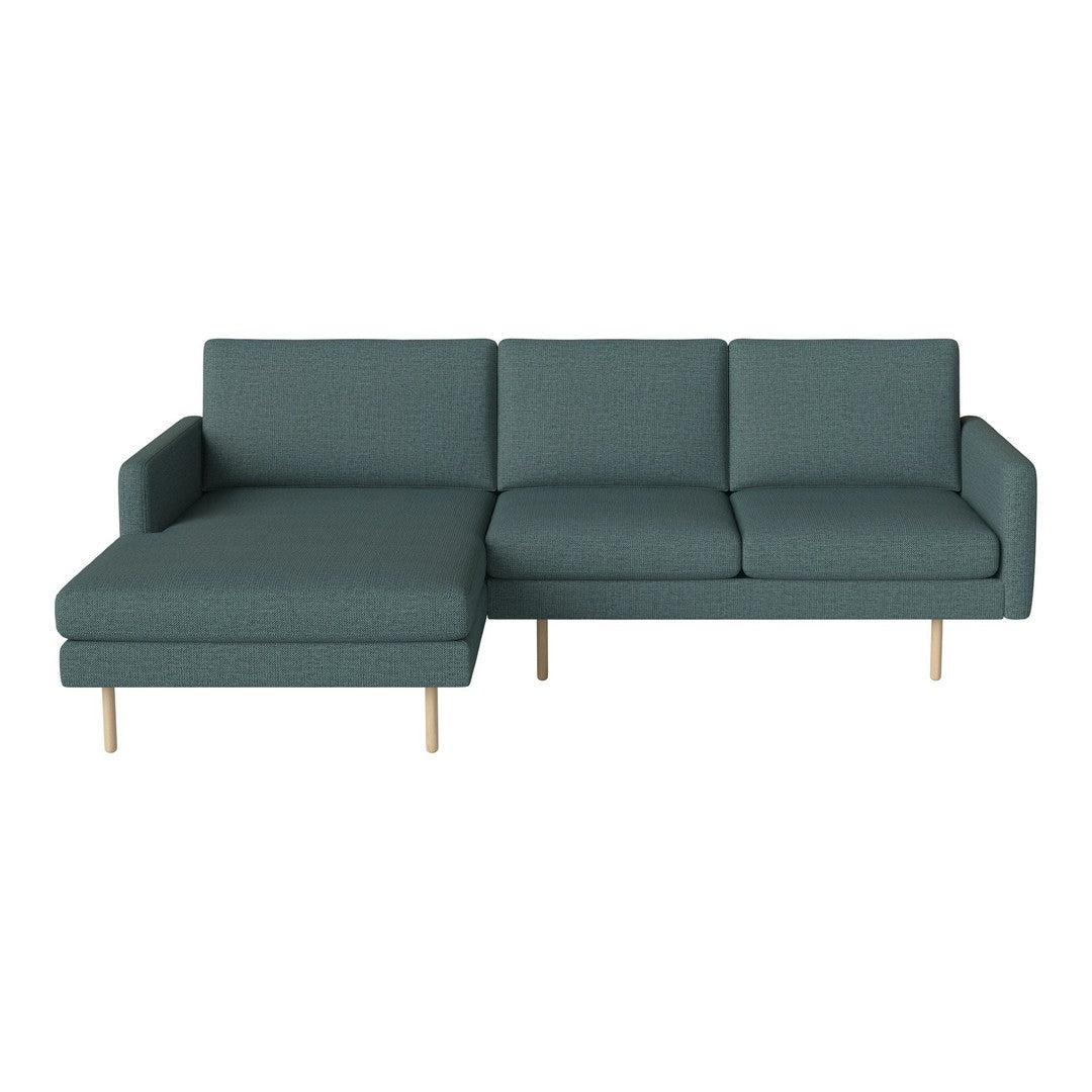 Teal green sectional sofa with a clean, modern design and smooth fabric upholstery. Perfect for contemporary living spaces.