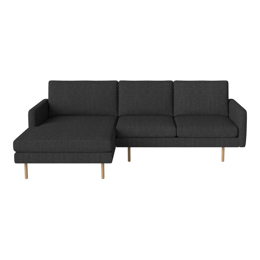 Dark gray sectional sofa with a minimalist design and light wood legs. Ideal for modern living spaces.