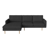 Contemporary dark gray sectional sofa with clean lines and light wooden legs. Perfect for modern living spaces.