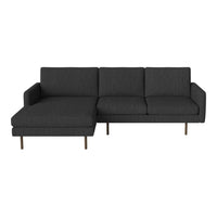 Elegant dark gray sectional sofa with a sleek design and subtle textured pattern, perfect for modern interiors.
