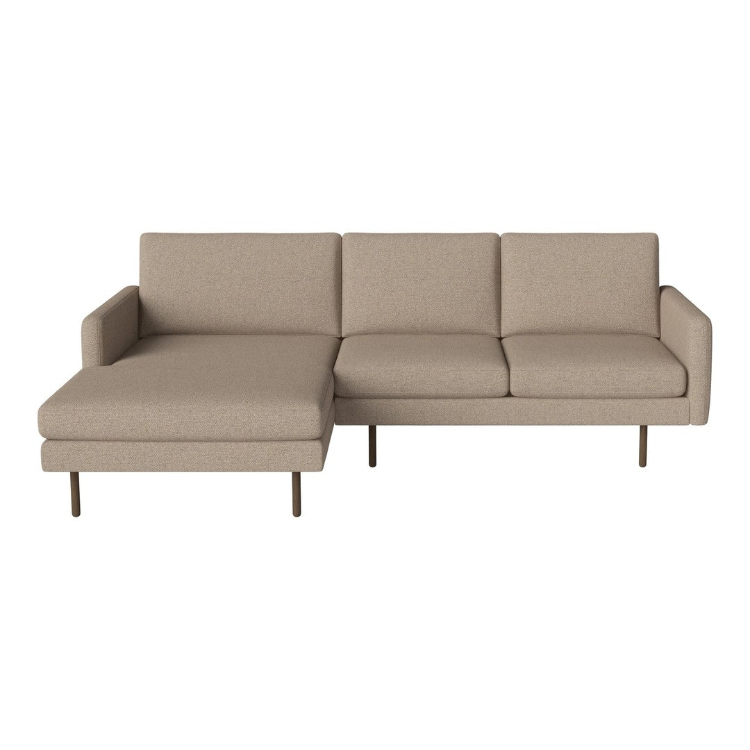 Beige sectional sofa with a minimalist design and clean lines, featuring a soft, textured fabric.