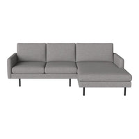 Modern grey sectional sofa with a smooth, minimalist design and black metal legs. Ideal for contemporary interiors.