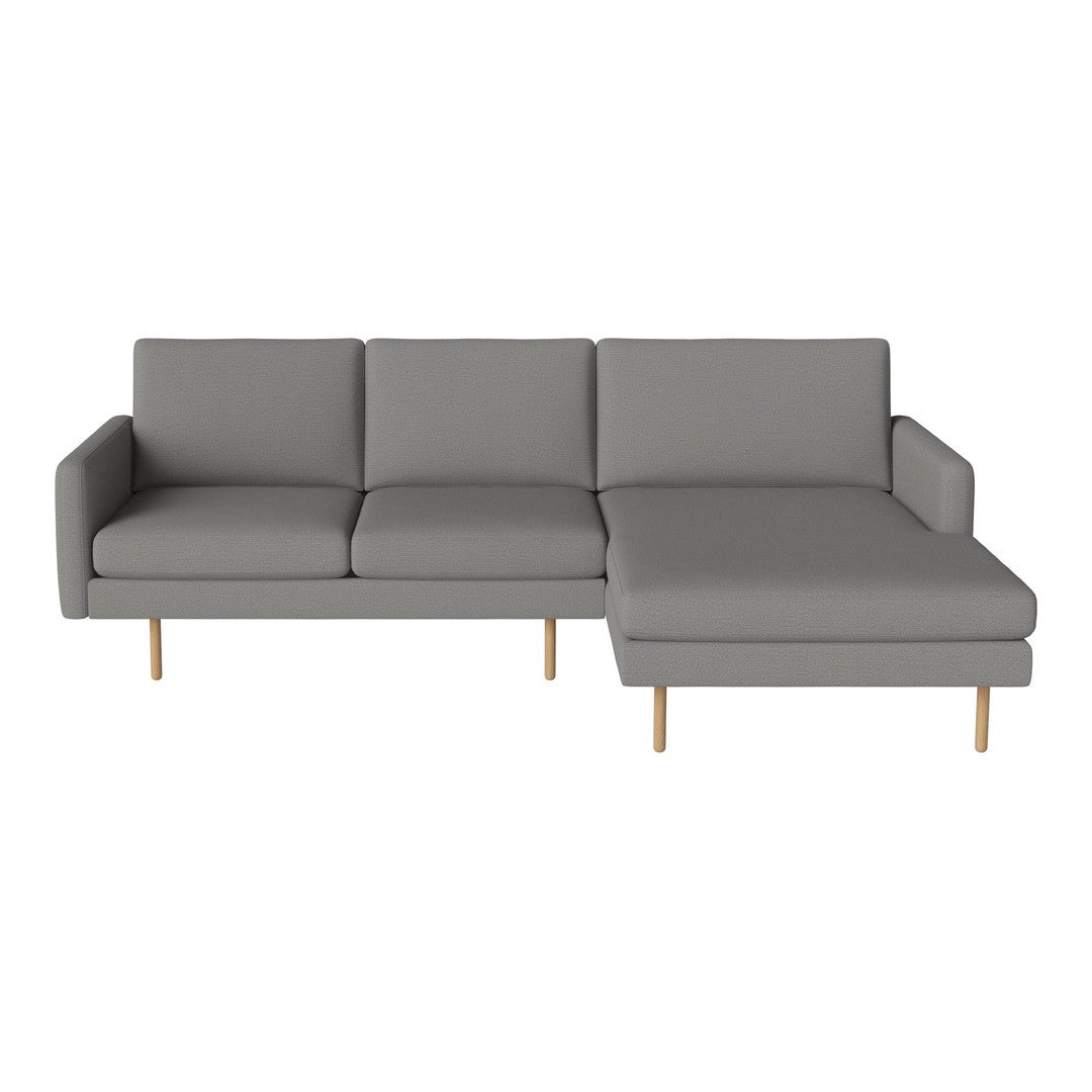 Stylish grey sectional sofa with clean lines and light wood legs, perfect for modern living spaces.