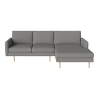 Modern gray sectional sofa with clean lines and a minimalist design, featuring light wood legs. Ideal for contemporary decor.