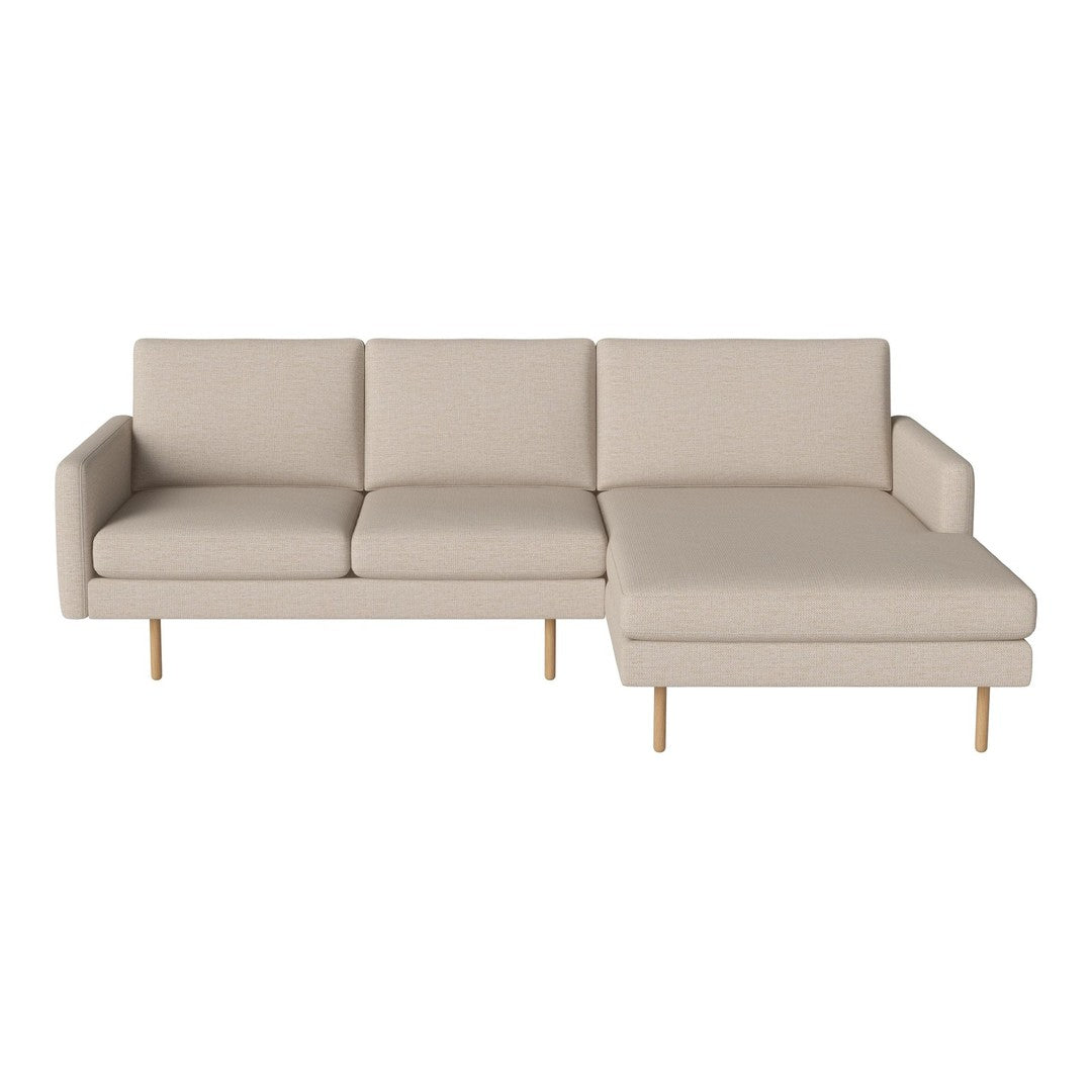 Beige sectional sofa with clean lines and a minimalist design, featuring smooth fabric and natural wood legs.