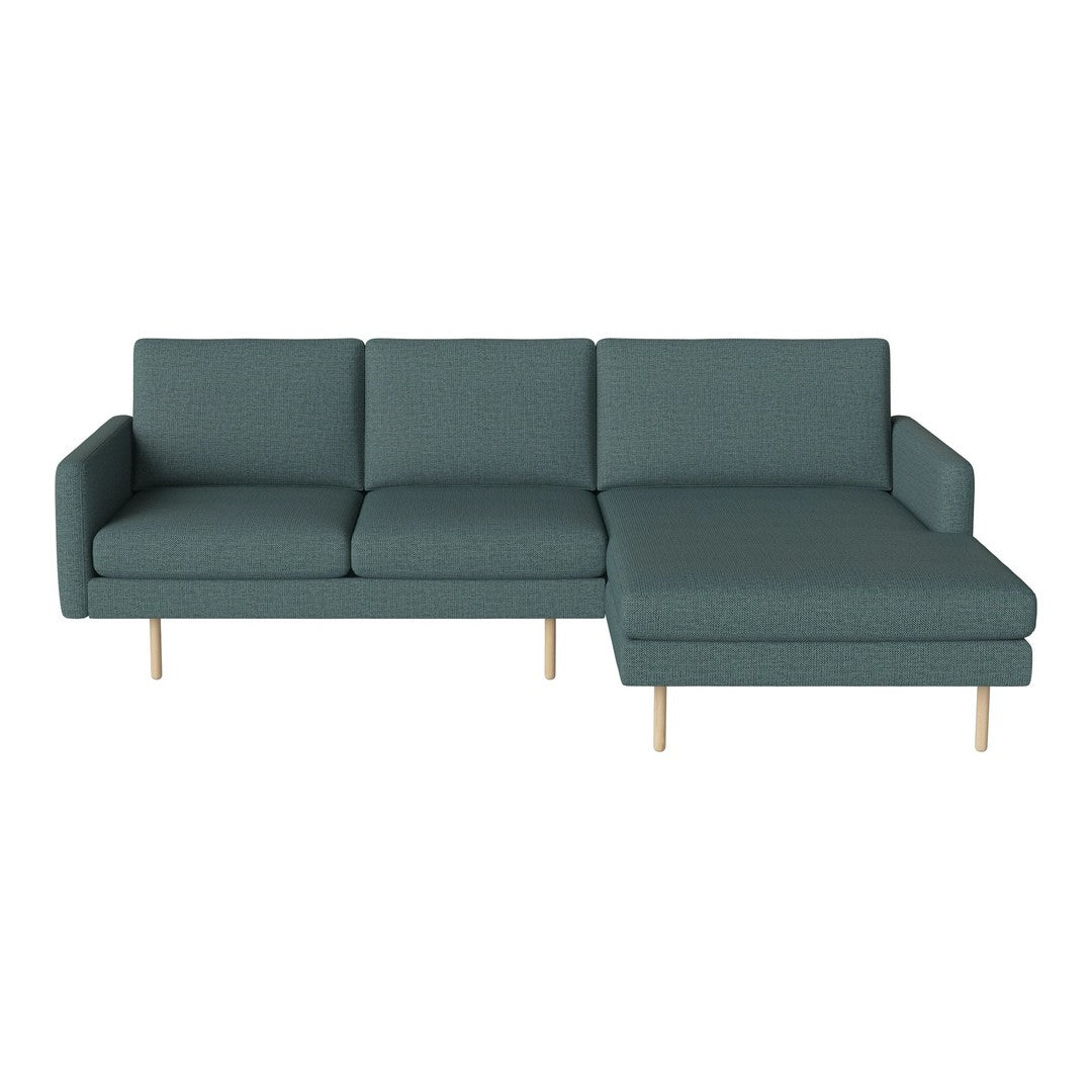 Teal fabric sectional sofa with a modern design and light wooden legs, featuring a sleek, minimalist aesthetic.