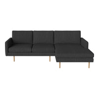 Modern dark gray sectional sofa with a sleek design and subtle textured pattern on fabric. Ideal for contemporary decor.