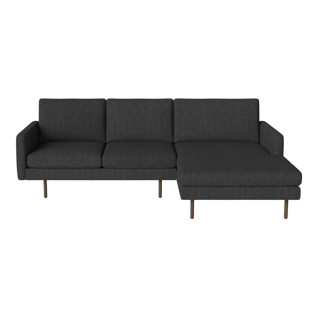 Sleek dark gray sofa with clean lines and subtle texture, featuring a stylish chaise lounge on one side.