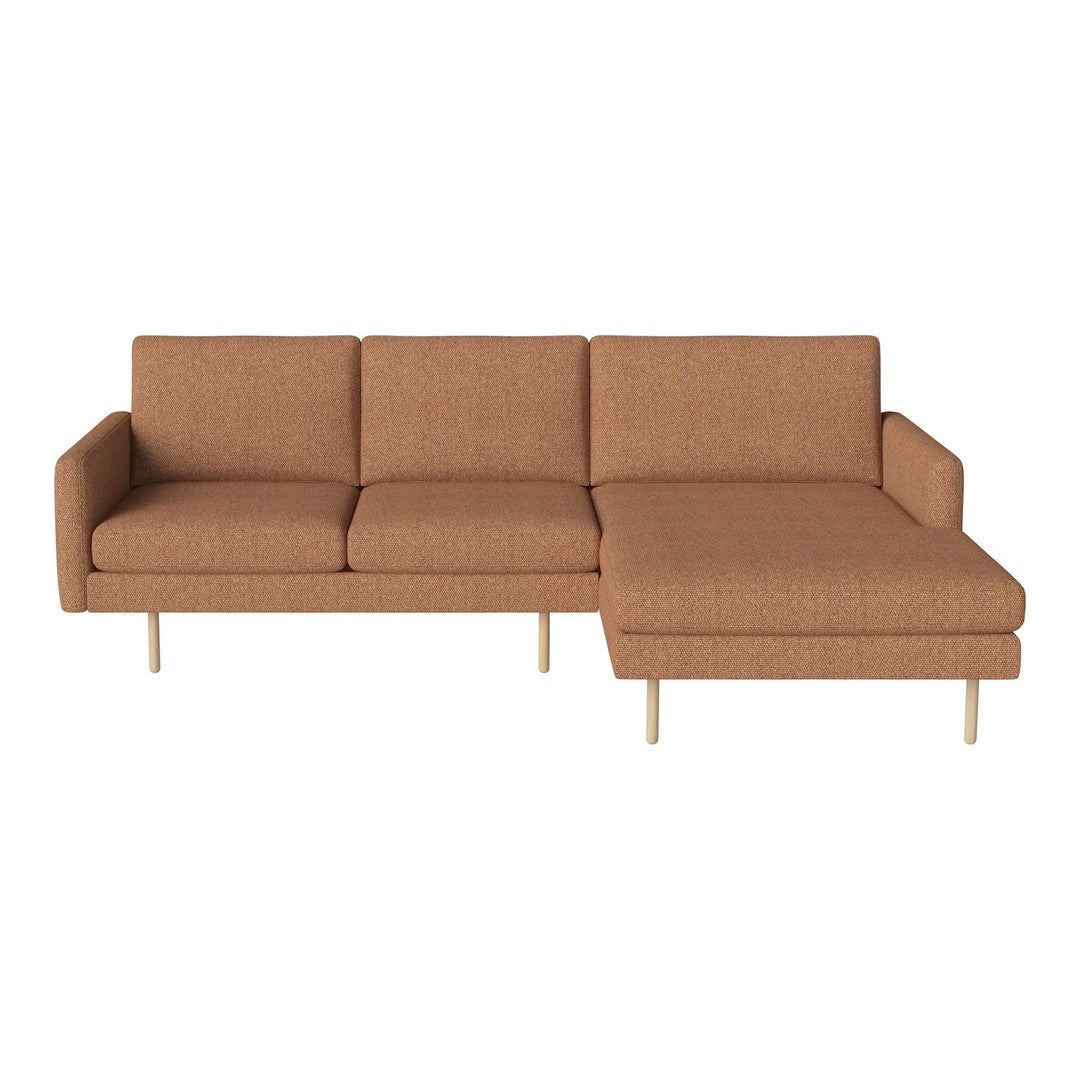 Rust-colored modern sectional sofa with a textured pattern and light wood legs. Perfect for contemporary living spaces.